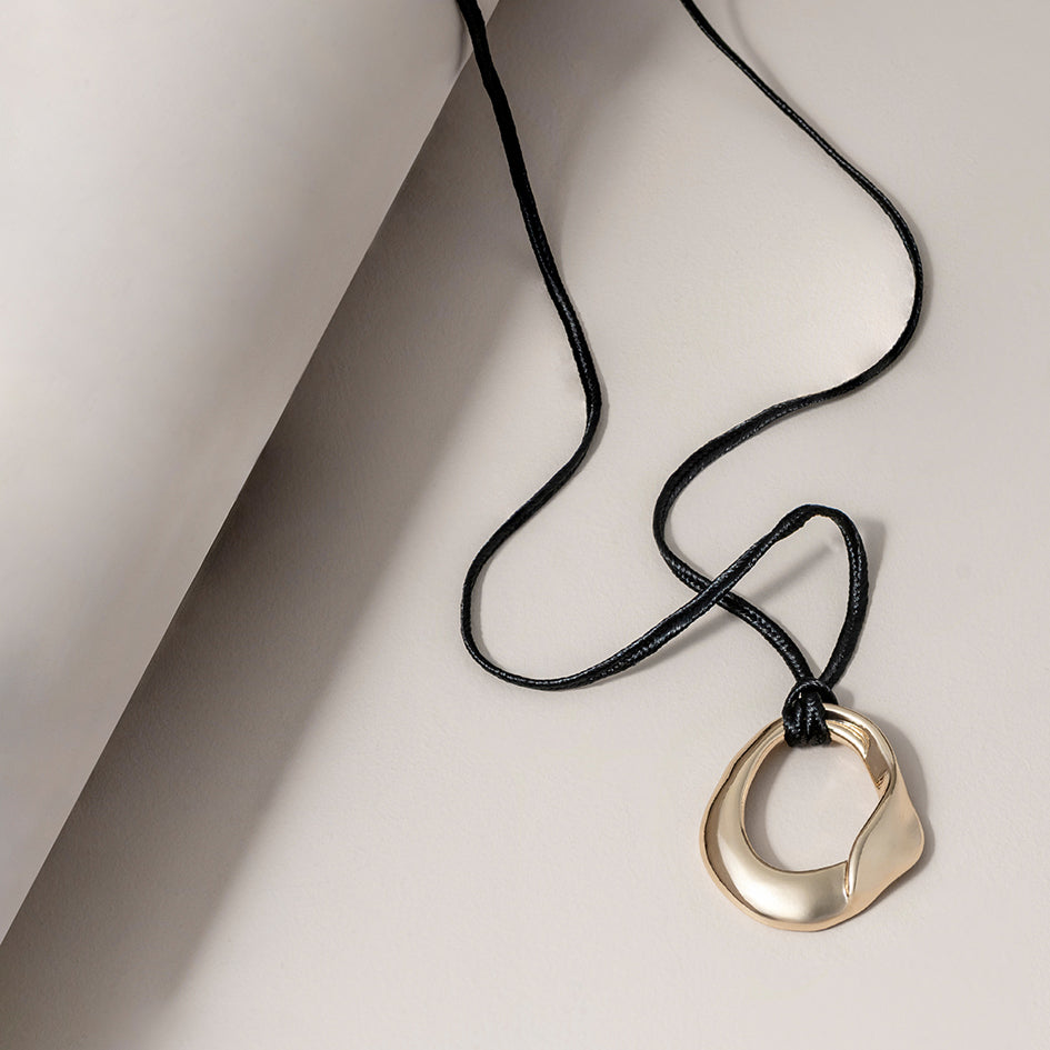 Long Sculptural Cord Necklace in Gold