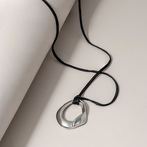 Long Sculptural Cord Necklace in Silver