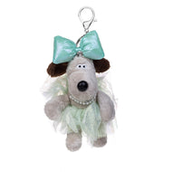 A plush dog keychain or bag charm with a mint green bow, a pale mint tulle skirt, and a rhinestone collar, attached to a silver lobster clasp on a white background.